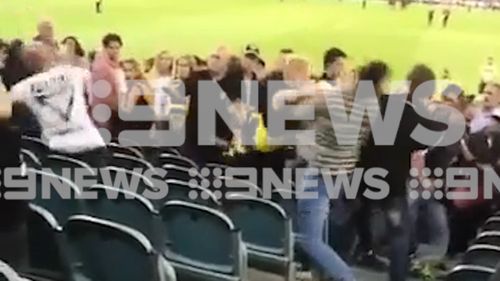 Video has emerged of a violent brawl in the MCG stands after last night's AFL season opener.