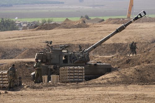 An Israeli mobile artillery unit is seen in a position near the Israel-Gaza border, Israel, Saturday, Oct. 28, 2023. 
