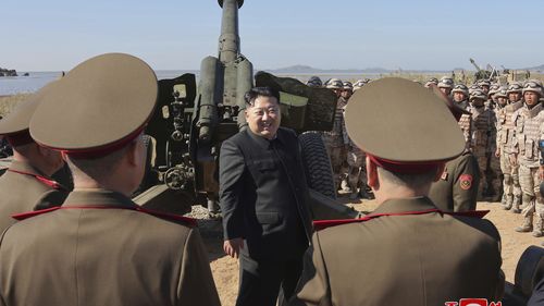 In this undated photo provided Oct. 6, 2024, by the North Korean government, its leader Kim Jong Un, centre, visits an artillery exercise at an undisclosed place in North Korea. 