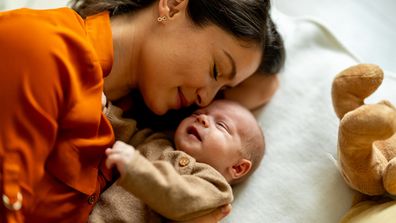 Mum with her newborn baby at home