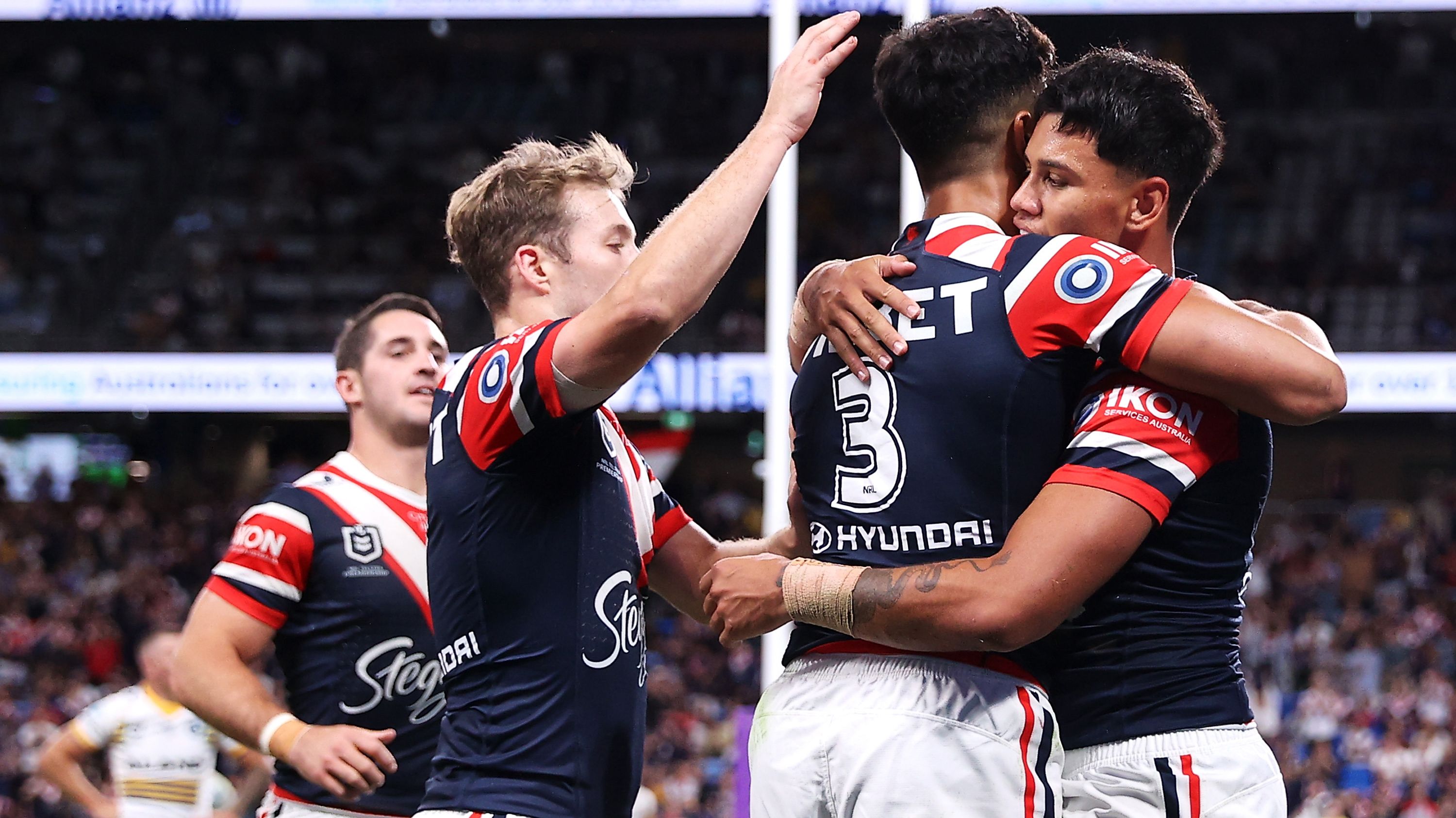 Jaxon Paulo celebrates with his teammates after scoring a try during the round five NRL match between the Sydney Roosters and the Parramatta Eels.