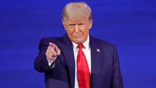 Former president Donald Trump points to cheering supporters as he is introduced before speaking at the Conservative Political Action Conference in February.