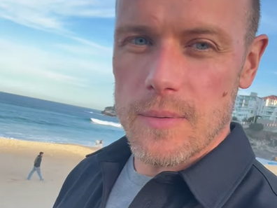 Sam Heughan walks along Bondi Beach in Sydney, June 2025