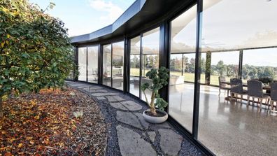 The astonishing half-moon Glass House in Gisborne, asking $2.3 million tree change property Domain real estate for sale unusual