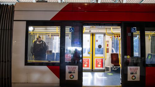 Commuters travelling on the Light rail.  Central Station. Sydney. Generic Public transport. Coronavirus COVID-19. 20th July 2021 Photo Louise Kennerley