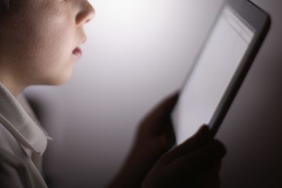 In this photograph illustration a ten-year-old boy uses an Apple Ipad tablet computer on November 29, 2011 in Knutsford, United Kingdom. Tablet computers have become the most wanted Christmas present for children between the ages of 6-11 years. Many parents are having to share their tablet computers with their children as software companies release hundredes of educational and fun applications each month.