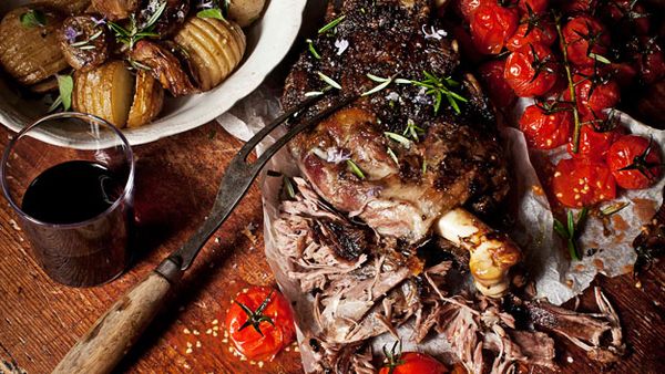 Slow-roasted greek lamb with tomatoes, onions and hasselback potatoes