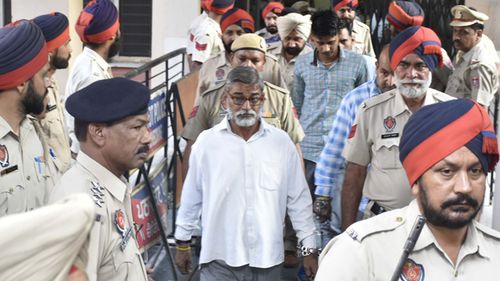 Sanji Ram, Tilak Raj and Parvesh Kumar, convicted in the Kathua rape and murder case, leave the District Court after it sentenced them to prison terms on June 10, 2019 in Pathankot, India.