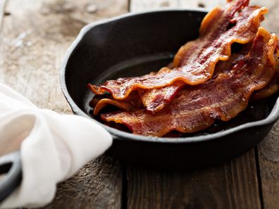 Cooking bacon in a pan.