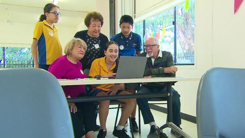 Seniors learn new technology from school kids