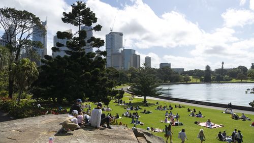 People picnic in Sydney's Botanical Gardens.