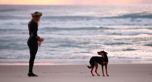 Alex Pullin's girlfriend Ellidy Vlug and kelpie Rummi pay respects in memory of Alex 'Chumpy' Pullin on July 11, 2020 in Gold Coast, Australia.