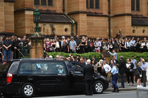 Mourners congregating outside the church. Picture: AAP
