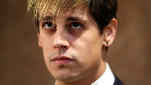 Milo Yiannopoulos listens during a news conference in New York on February 21, 2017. (AAP)