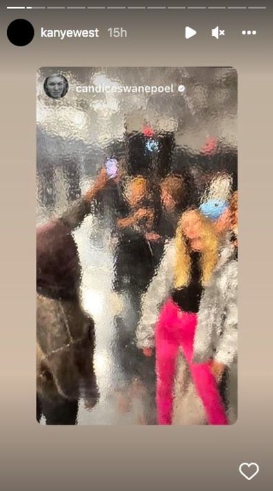 Kanye West snaps a photo of Candice Swanepoel during New York Fashion Week.