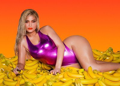Kylie poses in a bright pink latex swimsuit for the launch photos of her 2018 Summer Kylie Cosmetics range back in July.