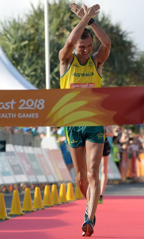 Dane Bird-Smith gestures while crossing the finish line. (AAP)