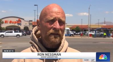 Ron Nessman saves baby boy in stroller from busy traffic. 