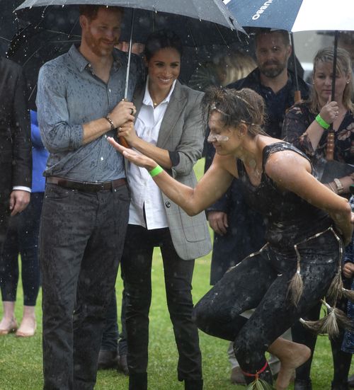 The couple had earlier watched an aboriginal dance performed in the rain.