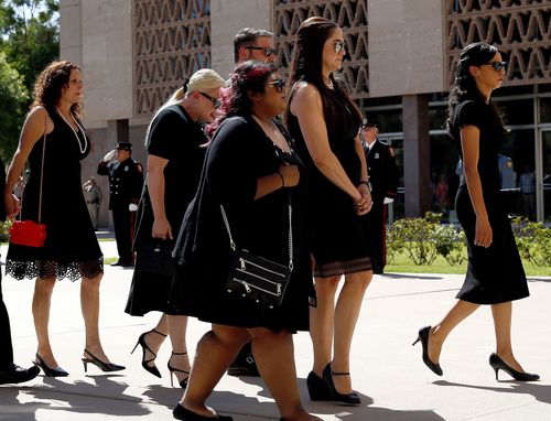 The McCain family arrive to pay their respects at the Arizona Capitol Rotunda.