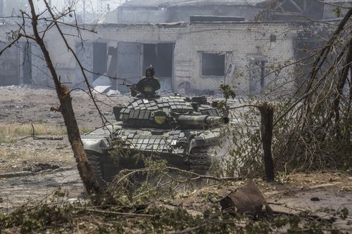 A Ukrainian tank is in position during heavy fighting on the front line in Severodonetsk, the Luhansk region, Ukraine, Wednesday, June 8, 2022.