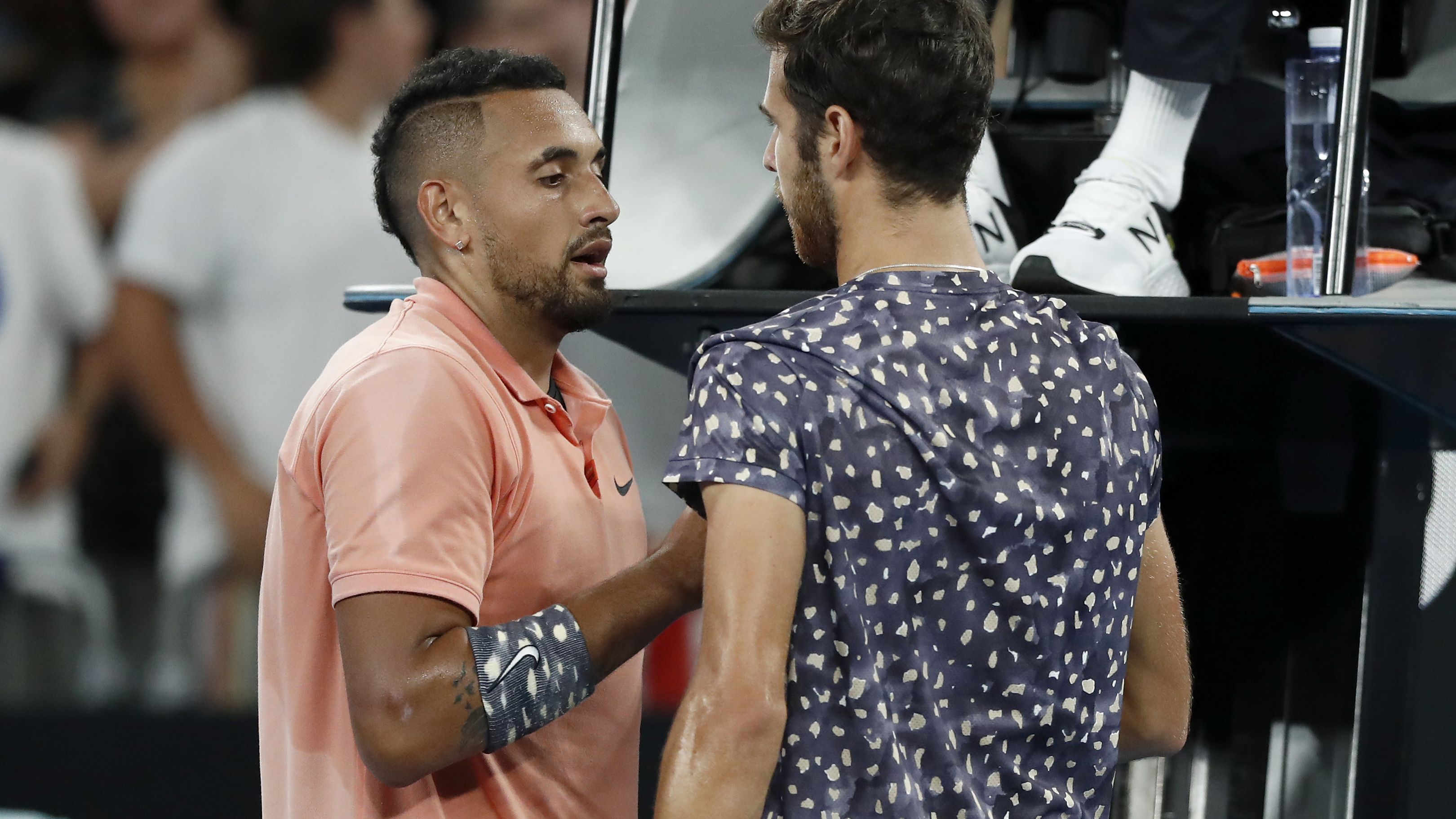 Nick Kyrgios of Australia shakes hands with Karen Khachanov of Russia after their third-round singles match at the 2020 Australian Open.