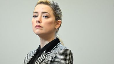 Actor Amber Heard stands in the courtroom at the Fairfax County Circuit Courthouse in Fairfax, Va., Tuesday, May 24, 2022.  