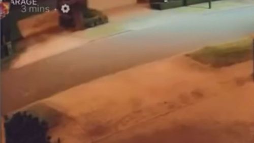 Video captured from CCTV cameras from a house in the suburb shows an orange light flash before a booming noise is heard seconds later. 