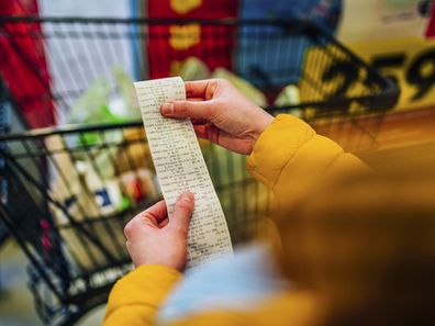 paying for groceries at the supermarket