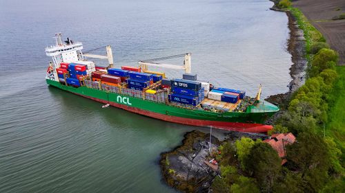 This aerial view shows the 443-foot NCL Salten grounded in the Trondheim Fjord.