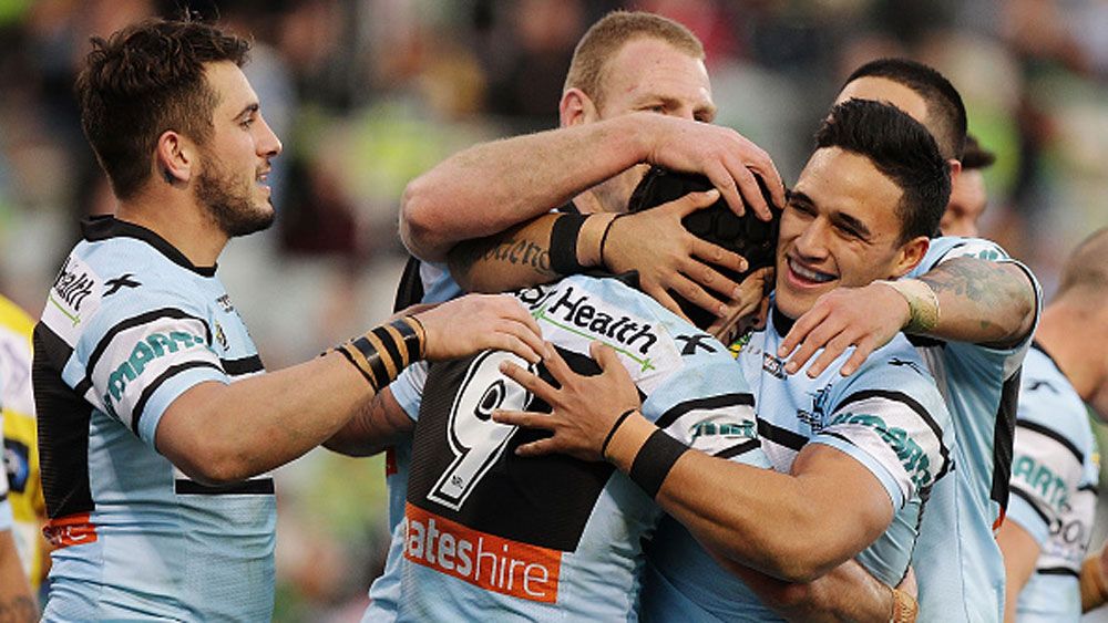 Cronulla players celebrate a try in 2015. (AAP)