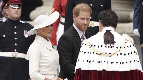 Prince Harry and Meghan, Duchess of Sussex arrive for the National Service of Thanksgiving held at St Paul's Cathedral as part of the platinum jubilee celebrations of Britain's Queen Elizabeth II, in London, Friday, June 3, 2022. (Aaron Chown/Pool photo via AP)