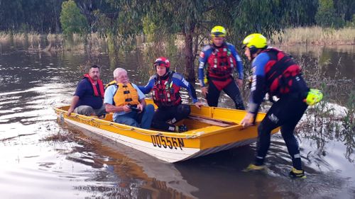 A Fire and Rescue NSW crew has rescued a man who was trapped in floodwaters in his four-wheel drive.
