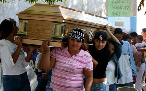 This 2016 file photo shows the funeral of a female-only gang member killed by the MS-13. (AP).