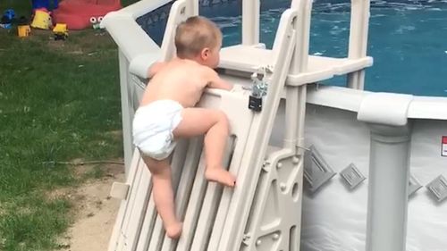 Cody was filmed by his dad scaling the locked pool ladder. (Facebook: Keith Wyman)