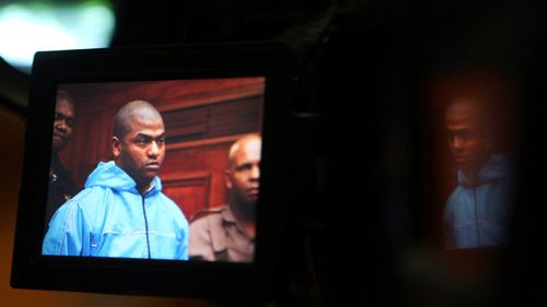 Thabo Bester is seen on a TV camera screen in the Western Cape High Court, in Cape Town, in 2012.