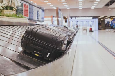 baggage claim area in the airport, abstract luggage line  with many suitcases