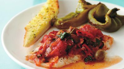 Recipe: <a href="http://kitchen.nine.com.au/2016/05/17/19/13/baked-fish-with-tomatoes-olives-and-garlic-bread" target="_top">Baked fish with tomatoes, olives and garlic bread</a>