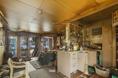 Fire-damaged home with soot, sagging ceilings and floors coming undone is heading to auction