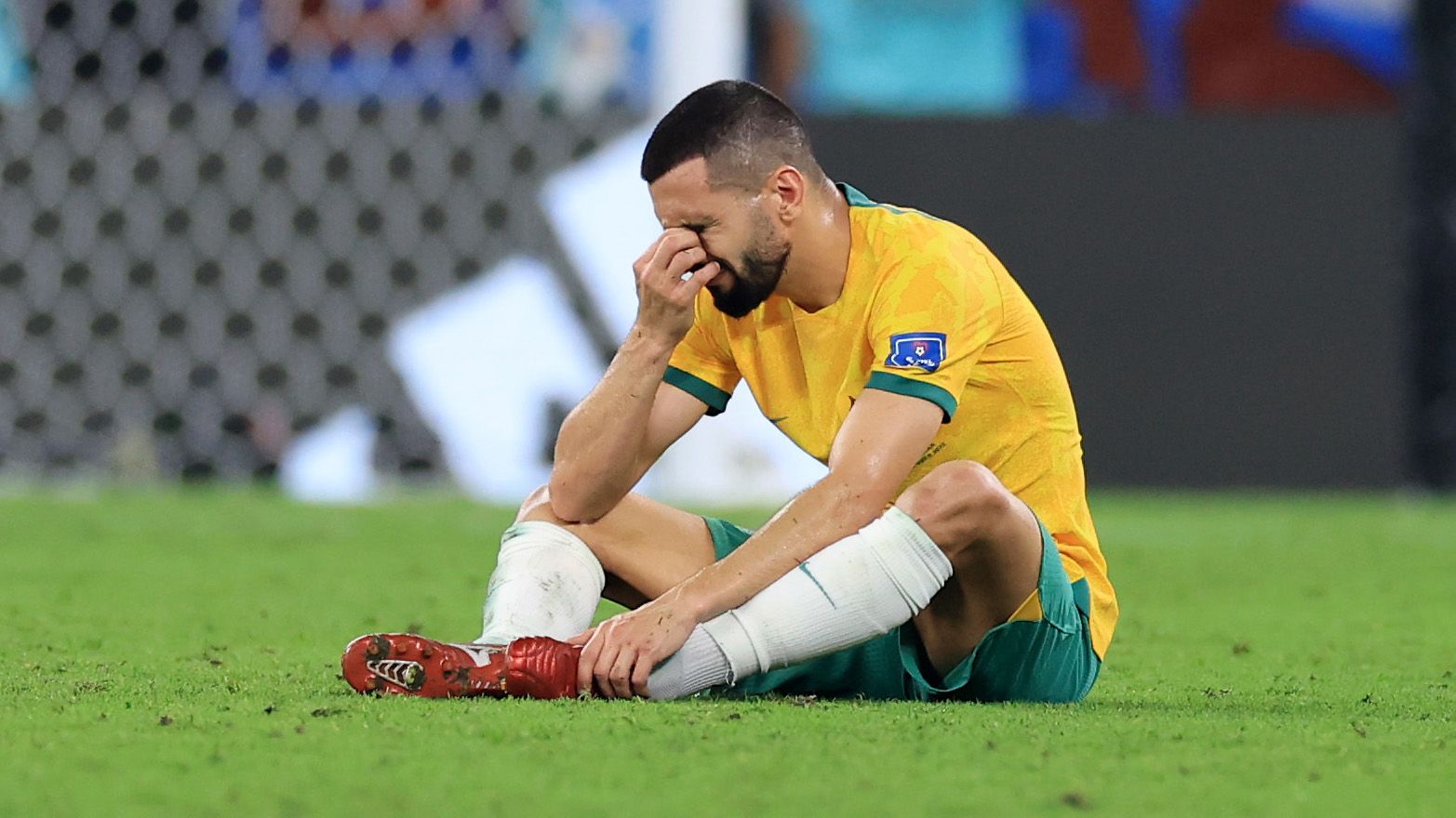 Aziz Behich of Australia shows dejection after the 1-2 defeat in the FIFA World Cup Qatar 2022 Round of 16 match between Argentina and Australia at Ahmad Bin Ali Stadium on December 03, 2022 in Doha, Qatar. (Photo by Buda Mendes/Getty Images)