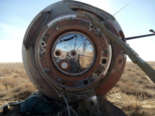 The Soyuz MS-10 space capsule lays in a field after an emergency landing near Dzhezkazgan.
