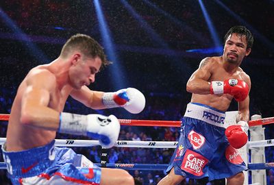 <b>Filipino icon Manny Pacquiao comprehensively dismantled American Chris Algieri to retain his WBO welterweight title at the Cotai Arena in Macau on Sunday.</b><br/><br/>Algieri, the unbeaten WBO light welterweight champion, was outclassed from the start with Pacquiao dropping him to the canvas six times during the 12 rounds. <br/><br/>Pacquiao won an overwhelming unanimous decision: 119-103, 119-103, 120-102 on the judges' cards in the southern Chinese city.