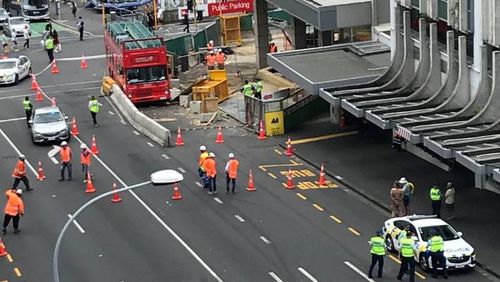 Witnesses claimed the City Sightseeing Tours bus rolled down the street with no driver inside before hitting the City Rail Link construction site.