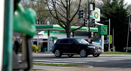 A vehicle drives past a BP gas station.