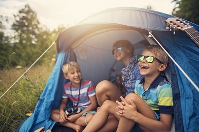Kids in tent. Kids camping. Kids playing