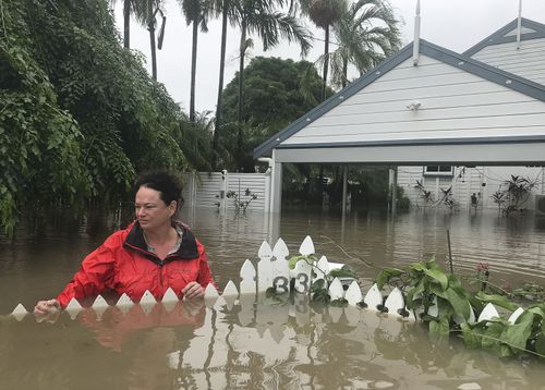 Andrew Rankin's shots of his wife Amelia at the couple's flooded home.