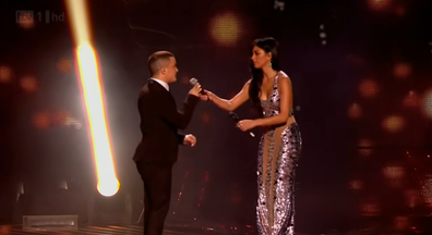 Nicole Scherzinger steals mic from mentee Jahmene Douglas.