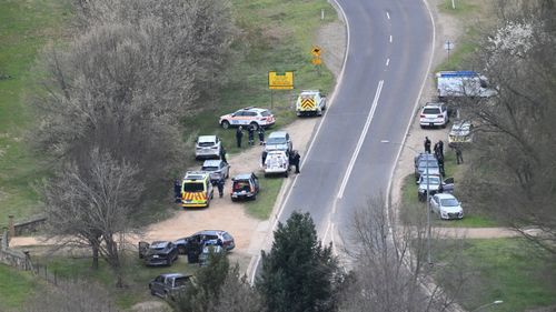 Victoria Police and emergency services at a rural property in Porepunkah, about 300 kilometres north-east of Melbourne, where two police officers have been shot dead and another is wounded. 26th August 2025, The Age news Picture by JOE ARMAO
