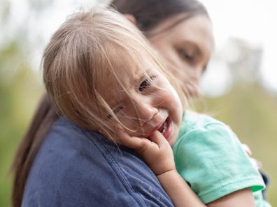 Girl is being comforted by her mother after she got hurt