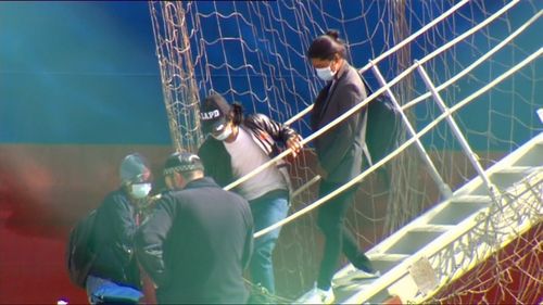 Workers disembarking the ship today.